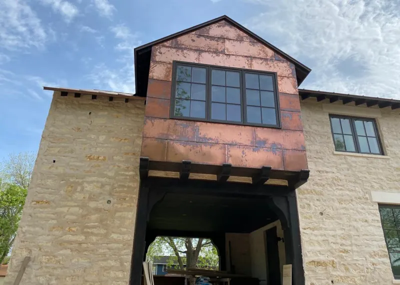 Copper metal panel facade on a stone building for Metal Roof Coating in Grosse Pointe Farms
